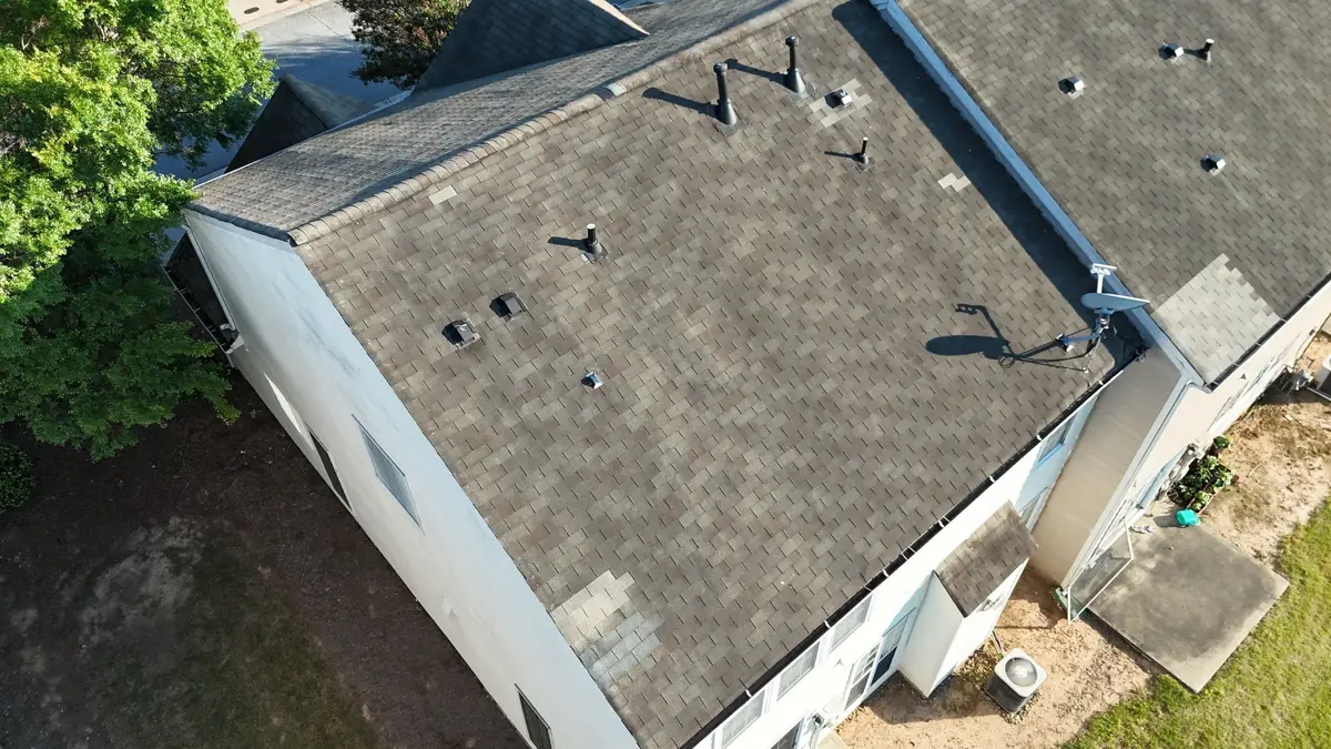 Aerial view of completed shingle roof with vents and gutters, Southern Premier Roofing work near Hoschton GA