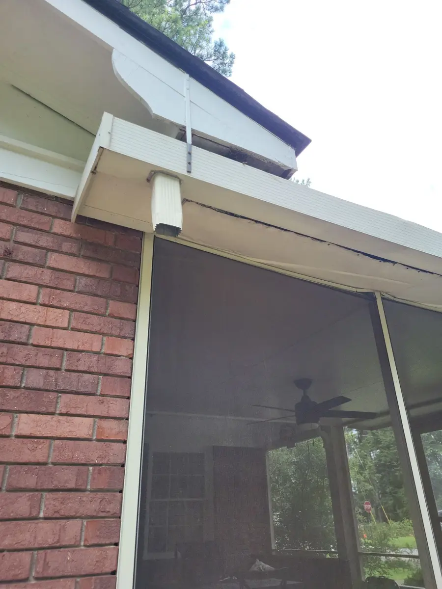 Close view of gutter and downspout along screened porch roof, Southern Premier Roofing work near Monroe GA