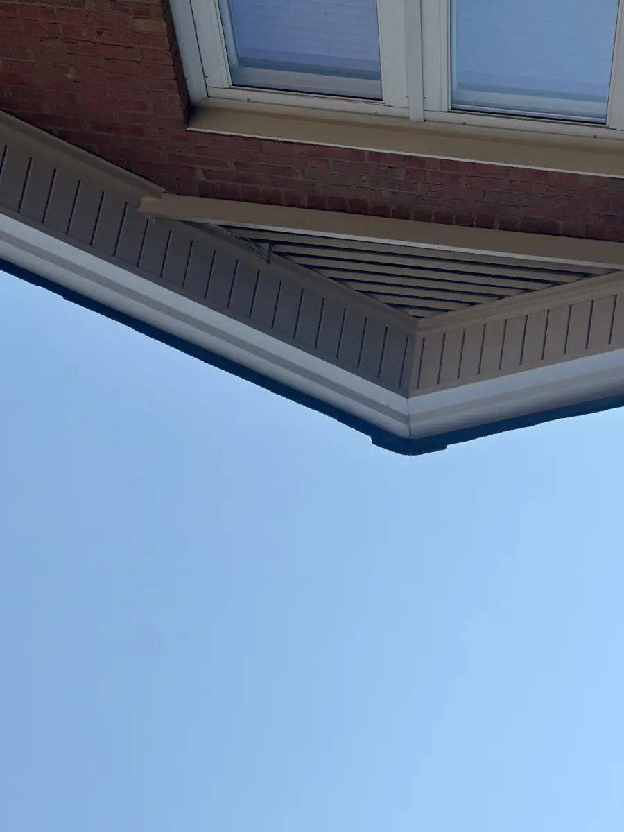 Close view shows soffit, fascia, and gutter detail beneath roof edge, Southern Premier Roofing work near Bethlehem GA