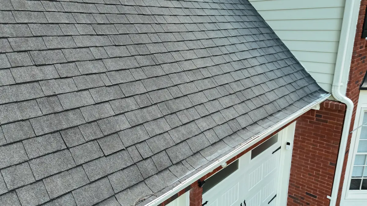 Broad finished shingle roof slope with gutter along eave, Southern Premier Roofing work near Statham GA