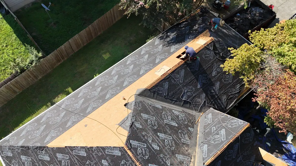 Roof deck partially exposed with plywood and underlayment sections visible, Southern Premier Roofing work near Athens GA