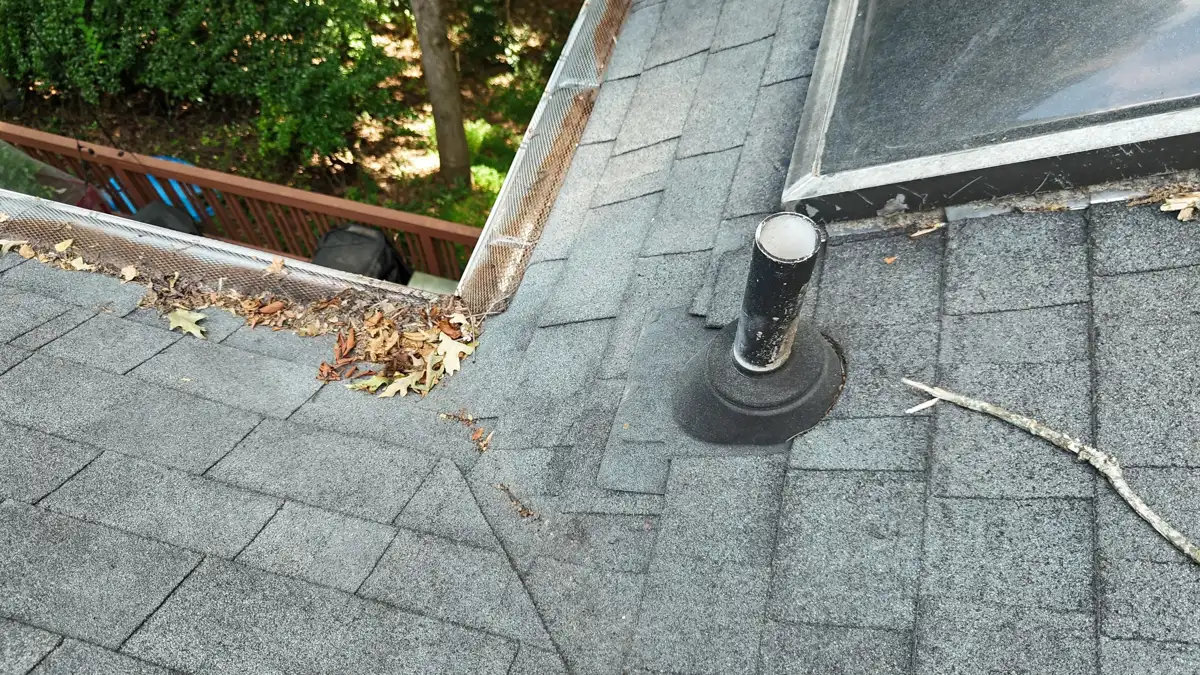 Roof penetration flashing beside open roof edge and surrounding shingles, Southern Premier Roofing work near Athens GA
