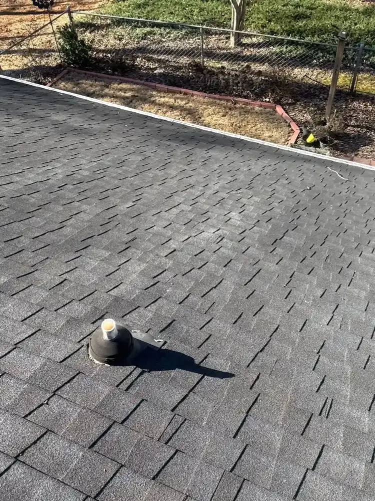 Gray shingle roof surface with small capped roof penetration, Southern Premier Roofing work near Berkeley Lake GA