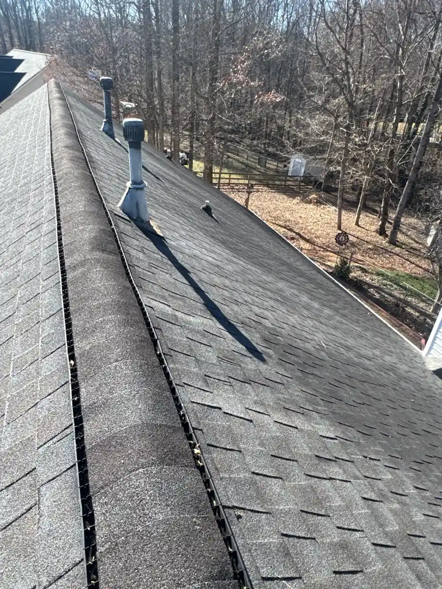 Long roof ridge with continuous vent and plumbing penetrations, Southern Premier Roofing work near Bethlehem GA