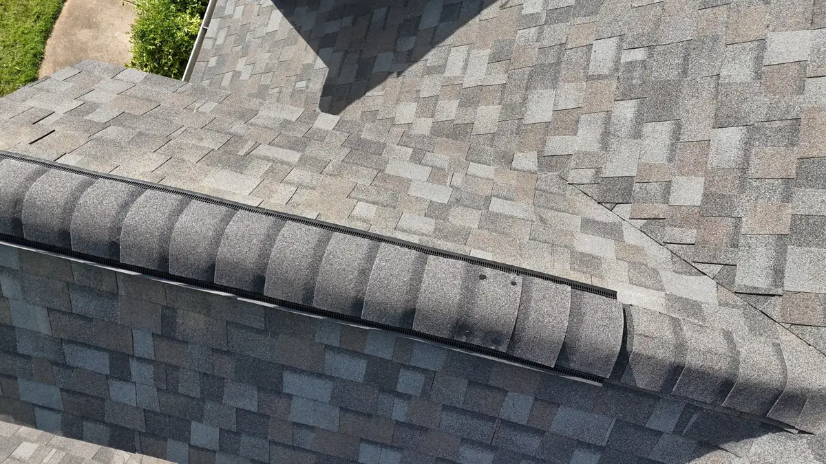 Close view of capped ridge vent on finished shingles, Southern Premier Roofing work near Bethlehem GA