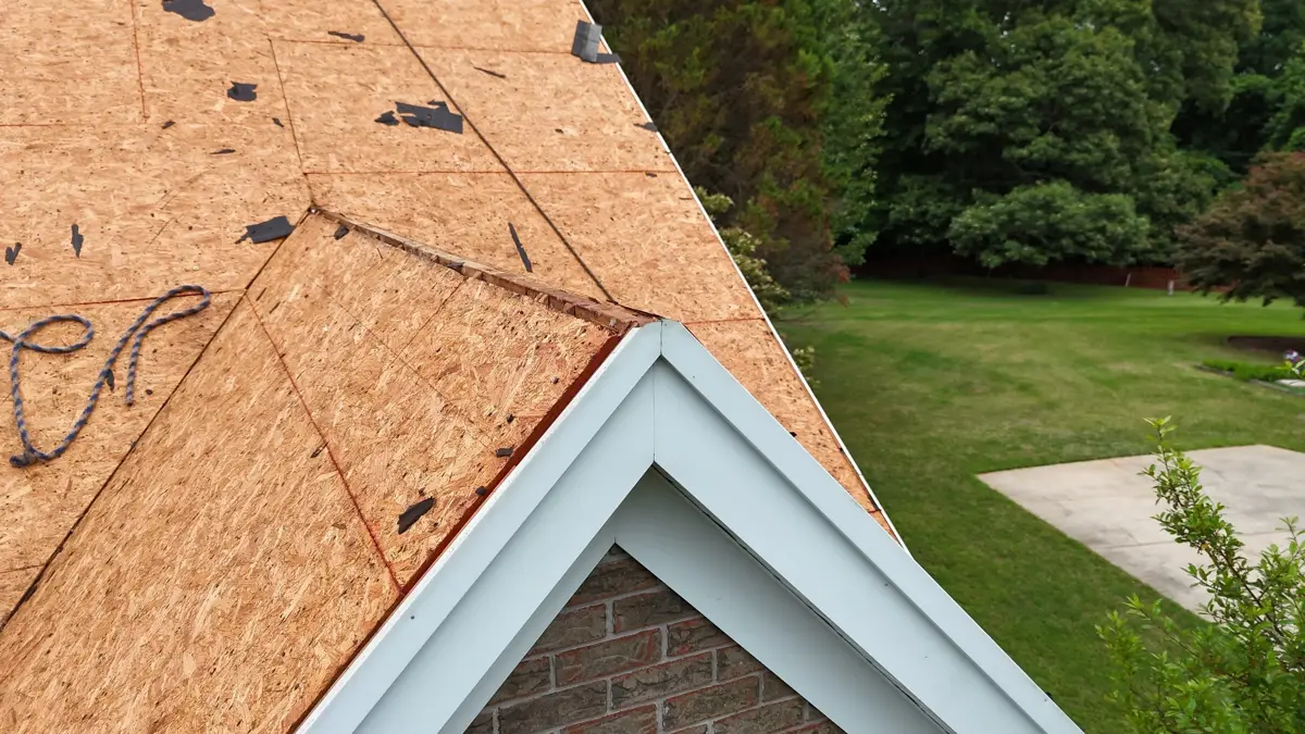 Exposed roof decking around gable edge above brick exterior, Southern Premier Roofing work near Bishop GA