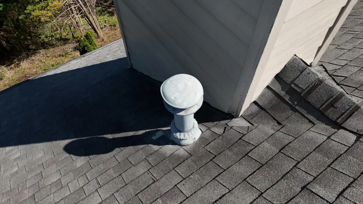 White roof vent beside wall with flashing and shingles, Southern Premier Roofing work near Bostwick GA