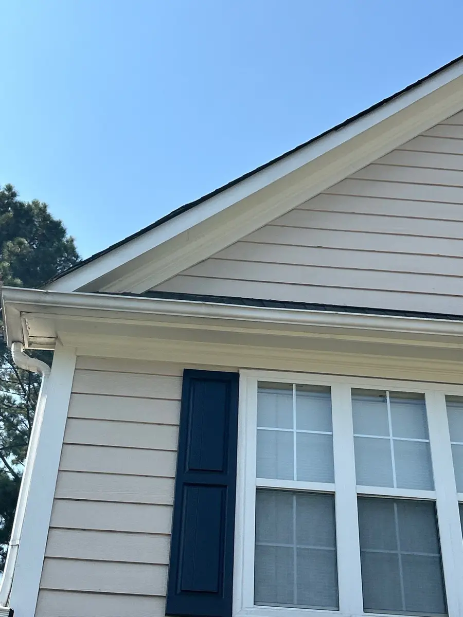 Finished house exterior shows clean siding, roof edge, and window, Southern Premier Roofing work near Braselton GA