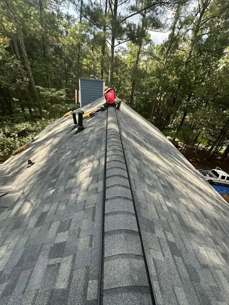 New shingles and continuous ridge vent extending along roof peak, Southern Premier Roofing work near Braselton GA