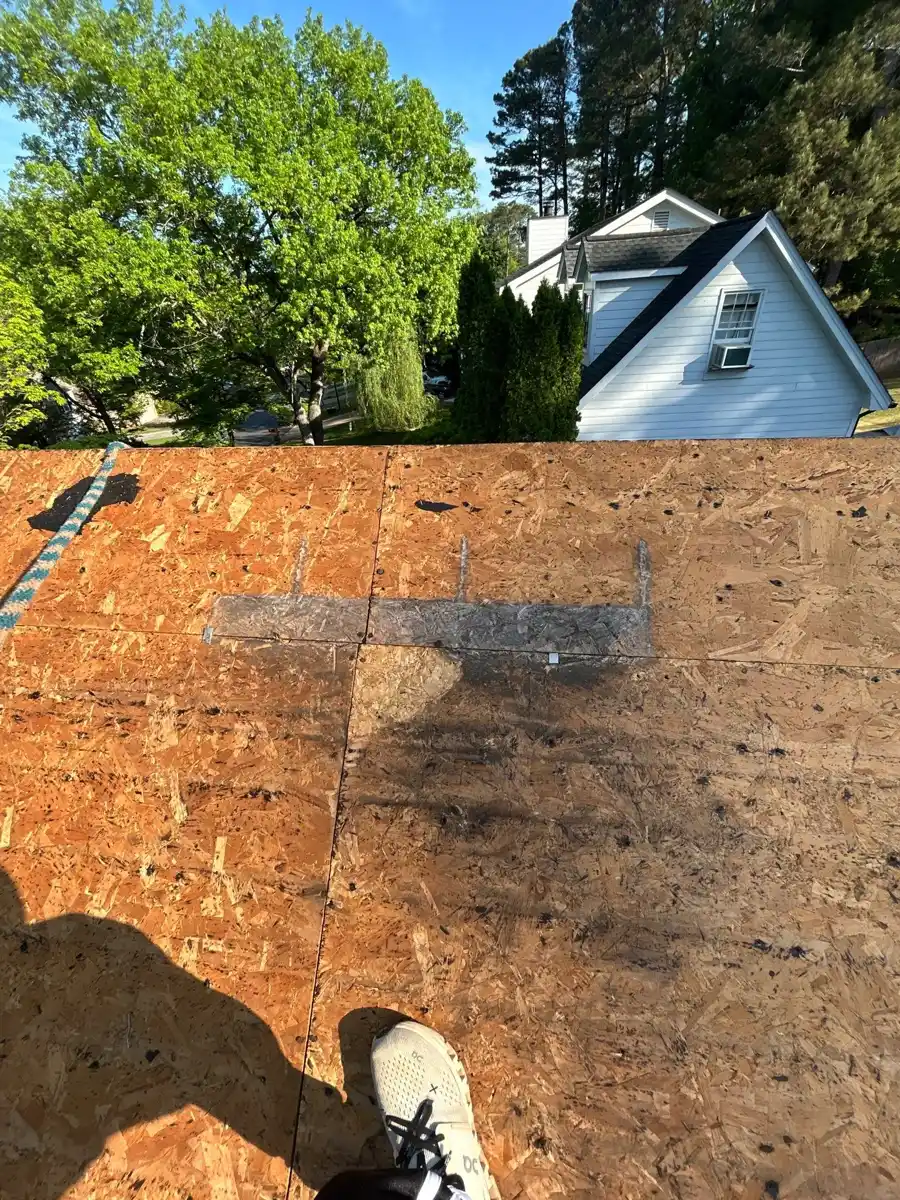 Wide view of exposed plywood roof deck with trees beyond, Southern Premier Roofing work near Buford GA