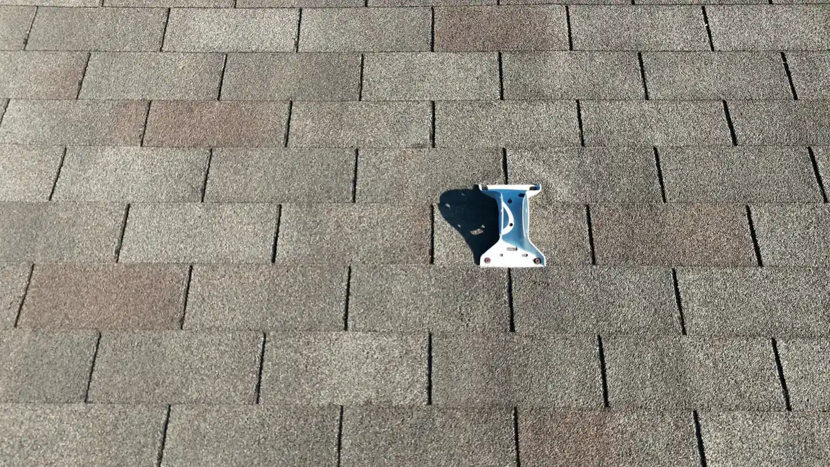 Small roof penetration sealed with flashing among asphalt shingles, Southern Premier Roofing work near Colbert GA