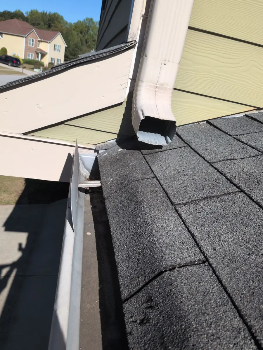 Roof valley and wall flashing beside gutter and downspout, Southern Premier Roofing work near Commerce GA