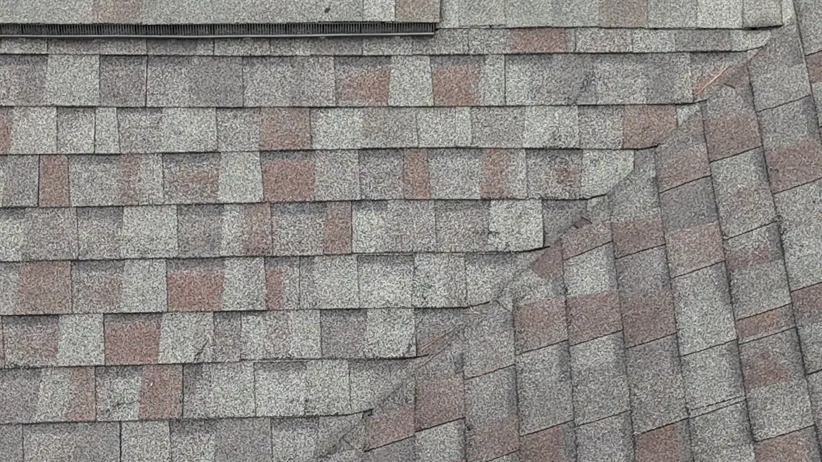 Roof shingles and step flashing detail around intersecting roof sections, Southern Premier Roofing work near Conyers GA