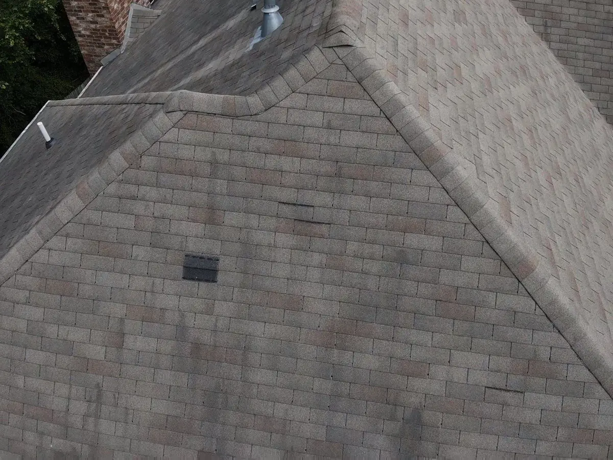 Roof ridge and hip shingles surrounding visible ventilation components, Southern Premier Roofing work near Covington GA