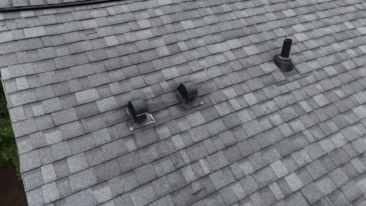 Close view of completed gray shingles and multiple roof vents, Southern Premier Roofing work near Duluth GA