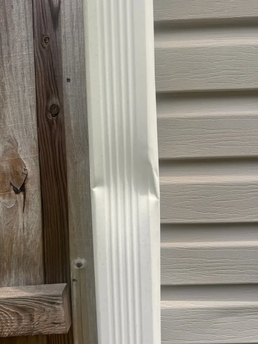 White vertical flashing installed beside gray house siding, Southern Premier Roofing work near Duluth GA