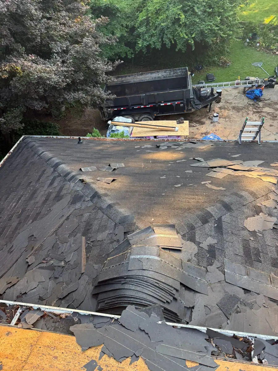 Widespread shingle removal exposes roof areas during replacement, Southern Premier Roofing work near Flowery Branch GA