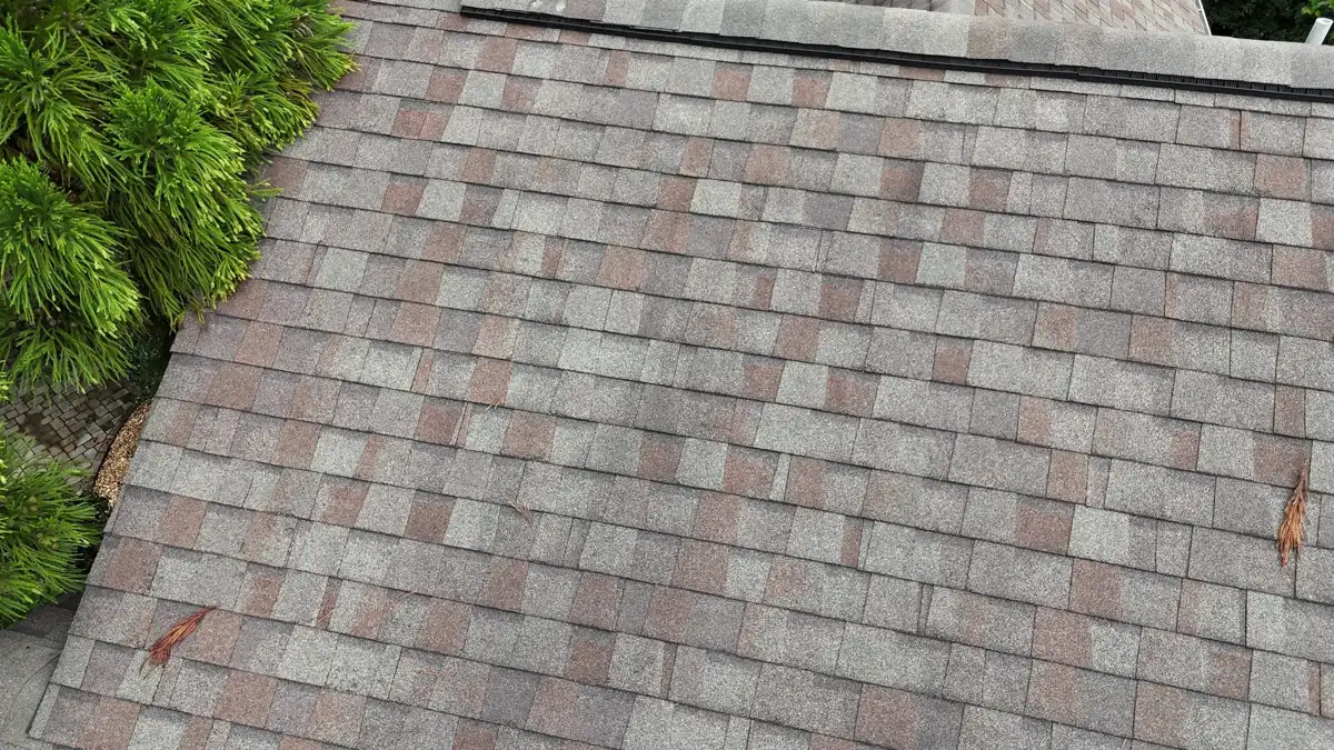 Completed shingle roof viewed from above with varied gray and red tones, Southern Premier Roofing work near Gainesville GA