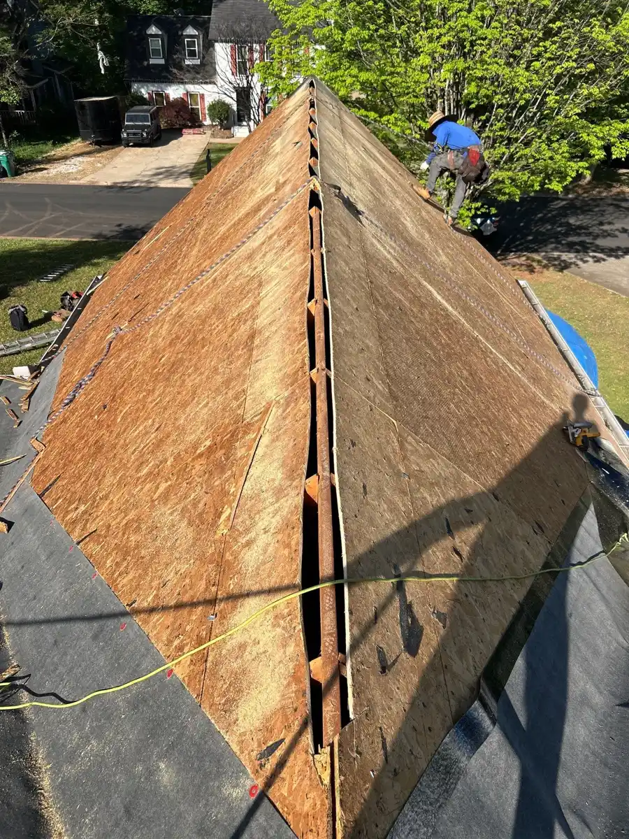 Roof slopes stripped to exposed wood decking during shingle removal, Southern Premier Roofing work near Homer GA