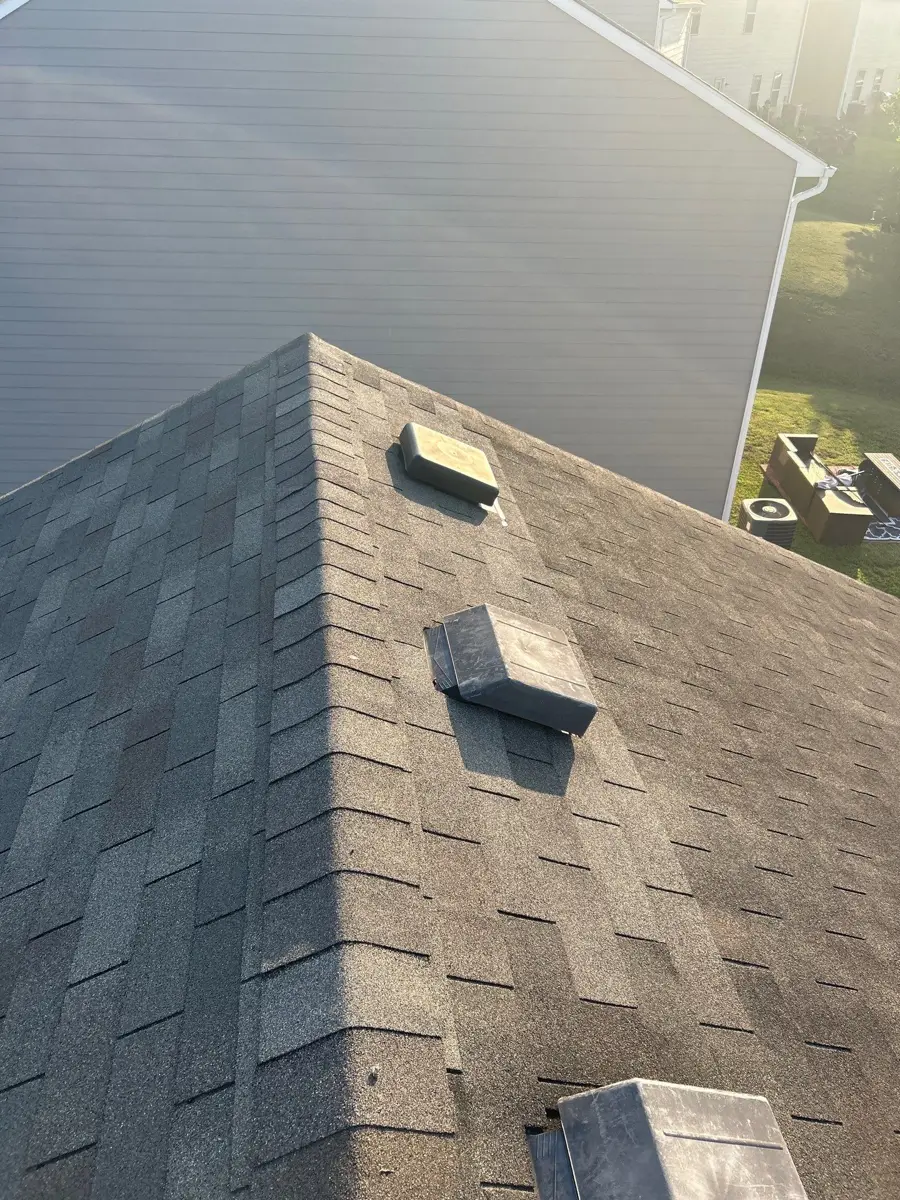 Roof valley and vents visible on completed shingle roof, Southern Premier Roofing work near Hull GA