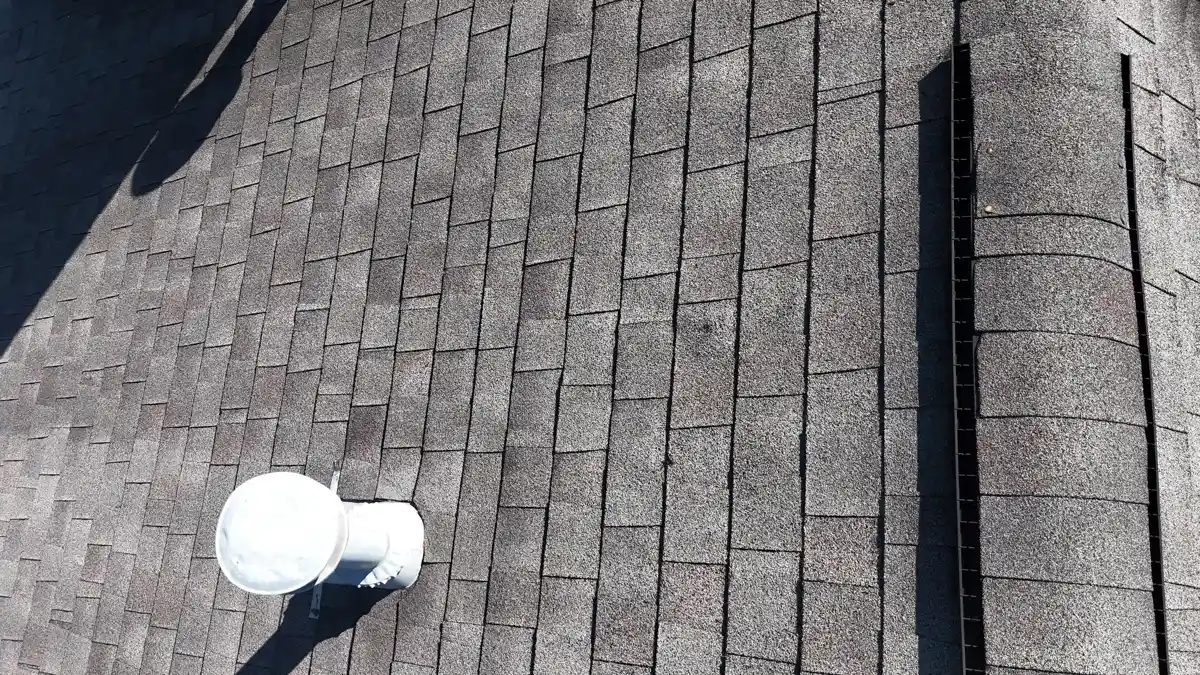 Gray shingle roof section with white plumbing vent and ridge cap, Southern Premier Roofing work near Jefferson GA