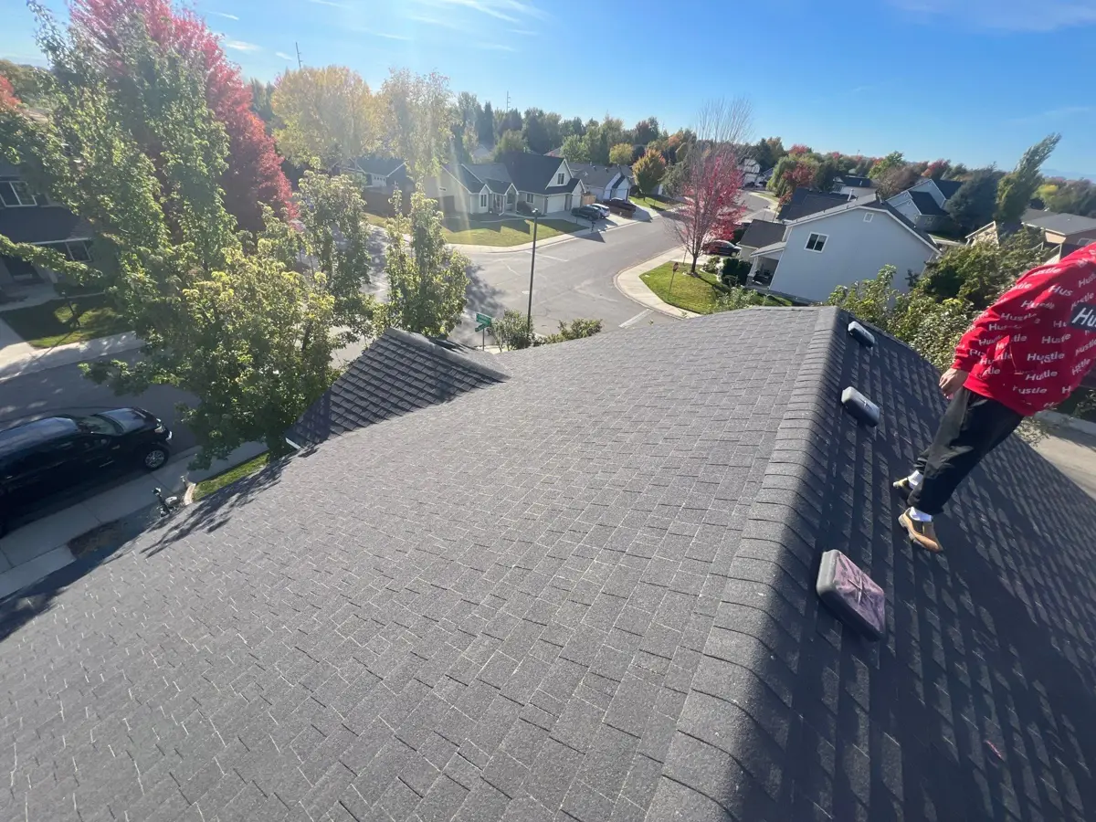 Wide view of completed shingle roof overlooking neighboring homes, Southern Premier Roofing work near Jersey GA