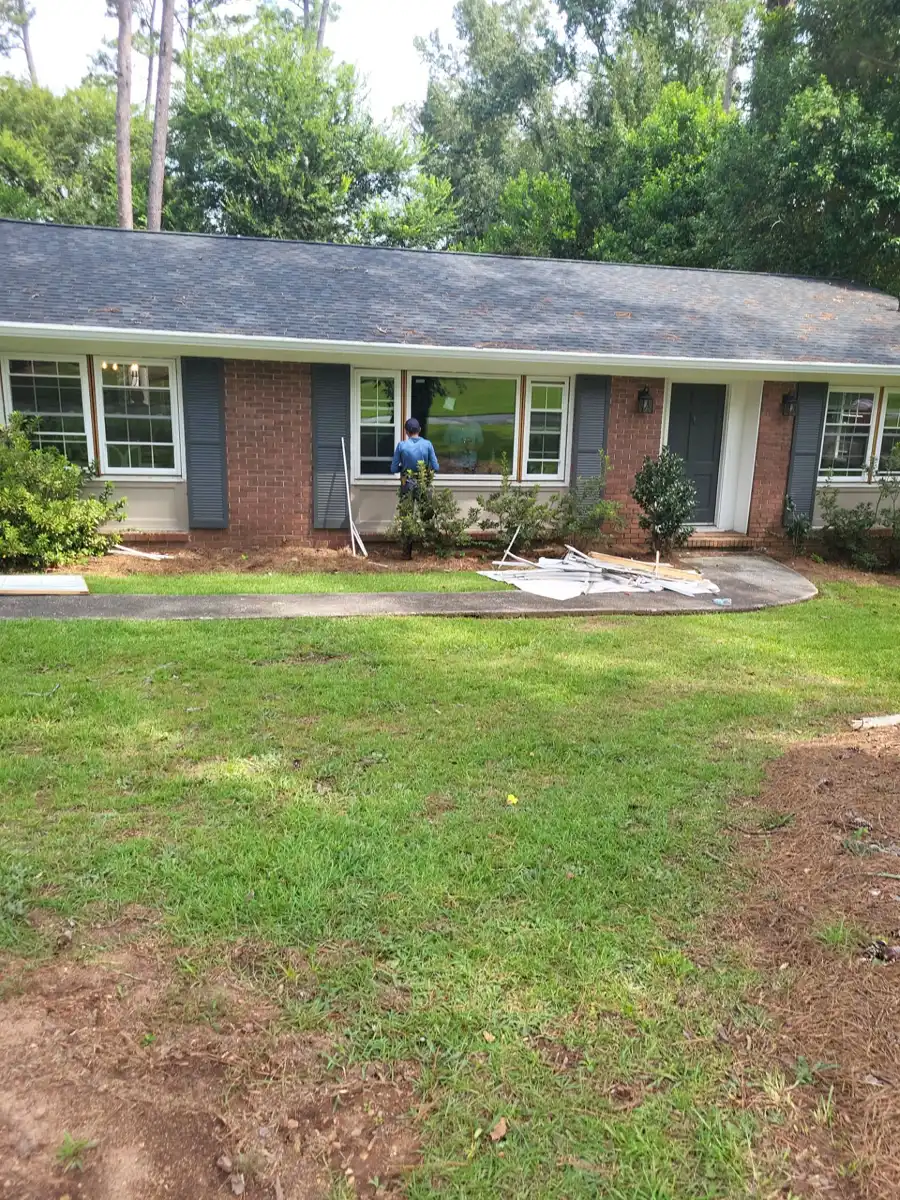 Wide view of completed shingle roof across brick ranch home exterior, Southern Premier Roofing work near Johns Creek GA