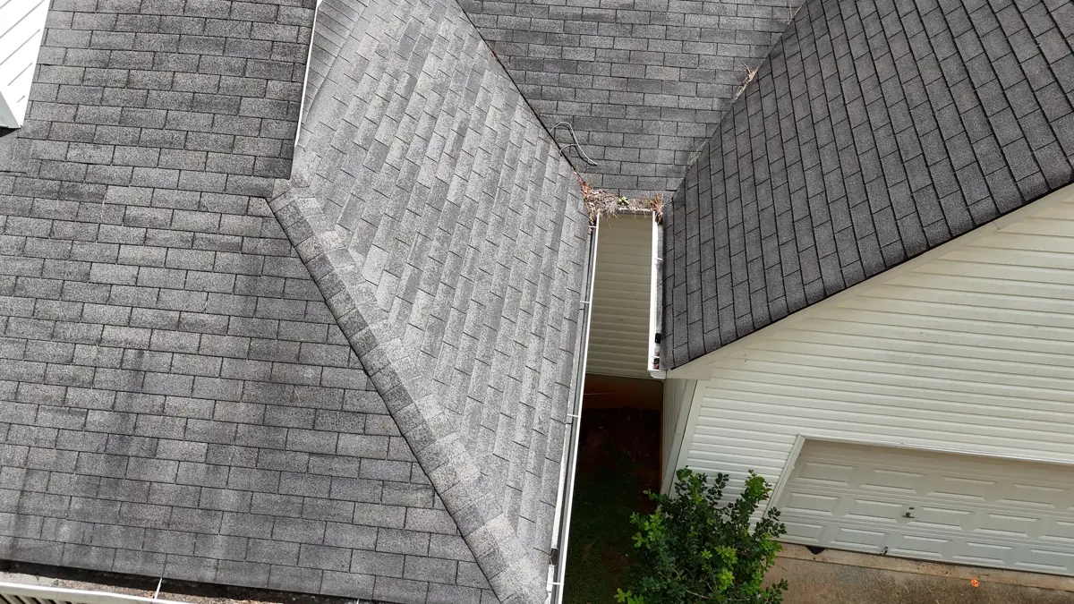 Roof valley and wall intersection with exposed narrow flashing area, Southern Premier Roofing work near Lawrenceville GA
