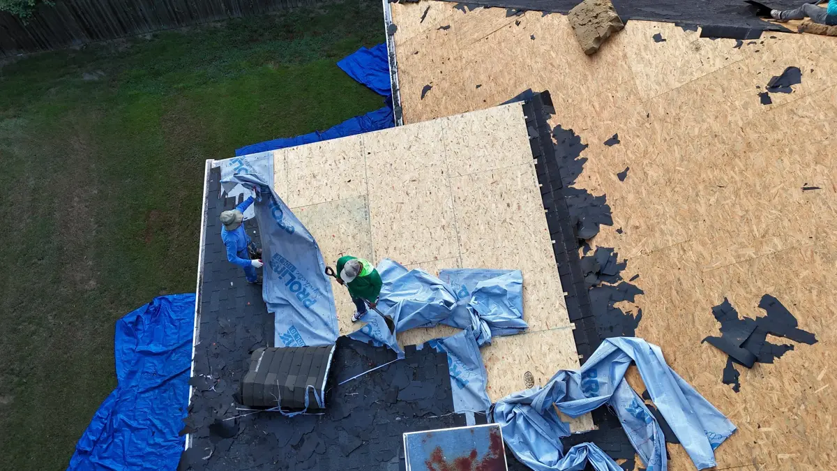 Roof decking exposed with removed roofing materials and tools visible, Southern Premier Roofing work near Nicholson GA