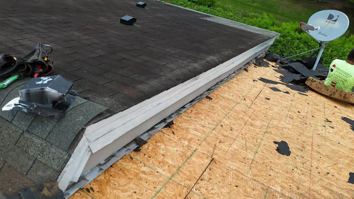 Roof section stripped to exposed decking beside remaining shingles, Southern Premier Roofing work near North High Shoals GA