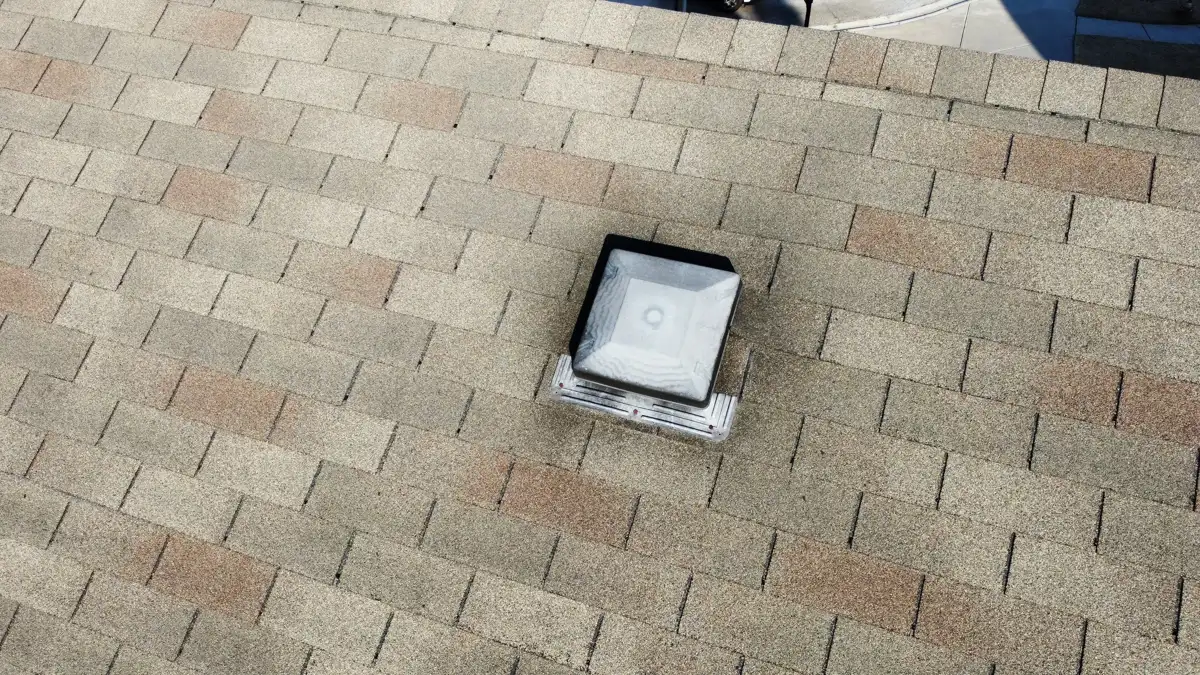 Roof vent flashing detail surrounded by clean asphalt shingles, Southern Premier Roofing work near Oxford GA
