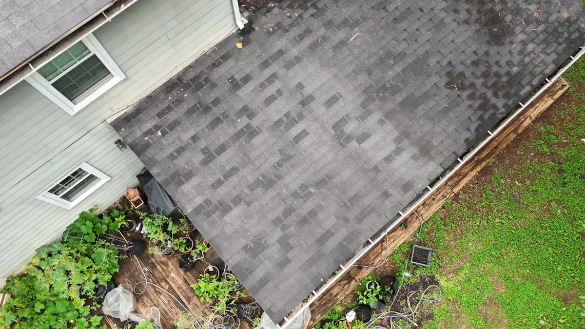 Aerial view of completed shingle roof beside home, Southern Premier Roofing work near Rest Haven GA