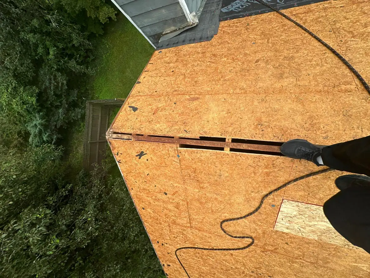 Roof decking closeup with long seam, cable, and exposed roof edge, Southern Premier Roofing work near Rutledge GA