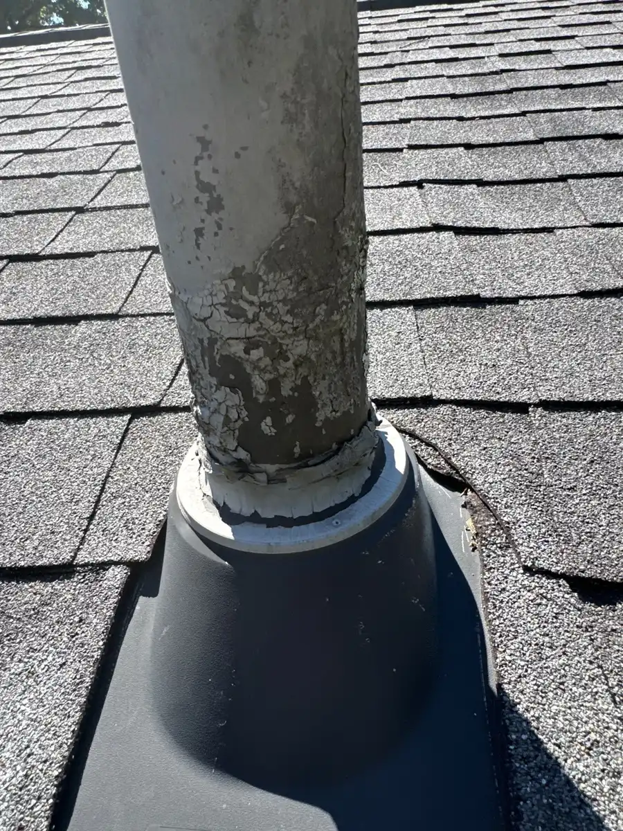 Roof vent pipe with weathered collar and surrounding shingles, Southern Premier Roofing work near Rutledge GA