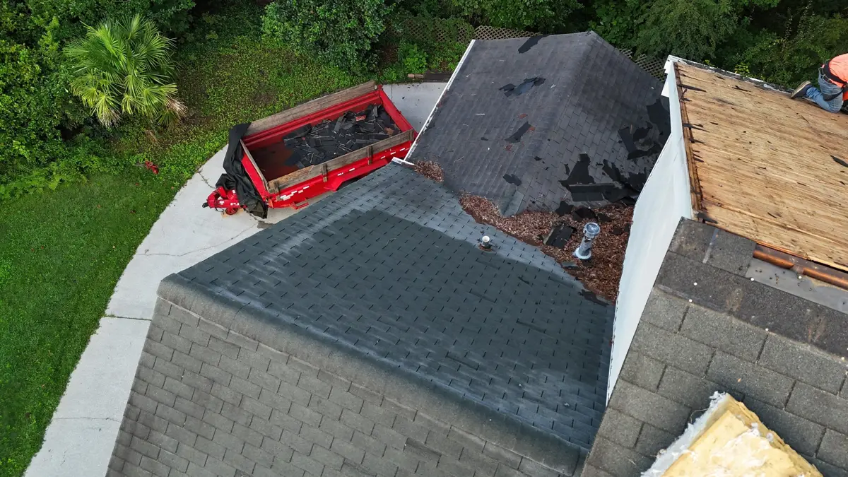 Roof section partially stripped beside newly shingled area, Southern Premier Roofing work near Social Circle GA