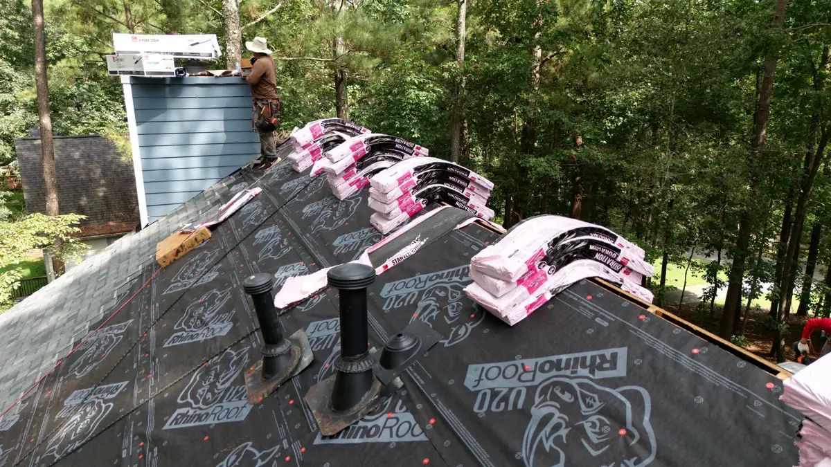 Roof underlayment, ridge vent components, and shingles visible, Southern Premier Roofing work near Stone Mountain GA