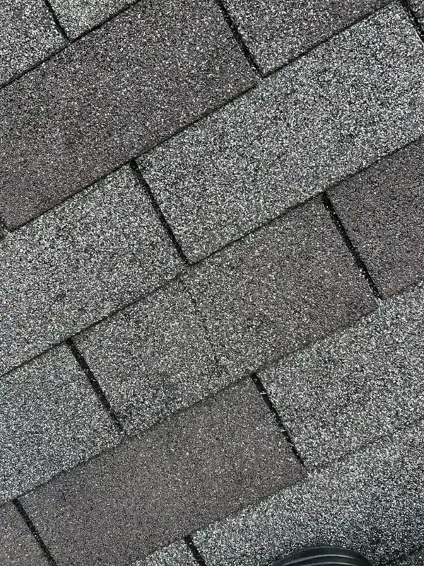 Close view of overlapping gray asphalt shingles on roof, Southern Premier Roofing work near Talmo GA