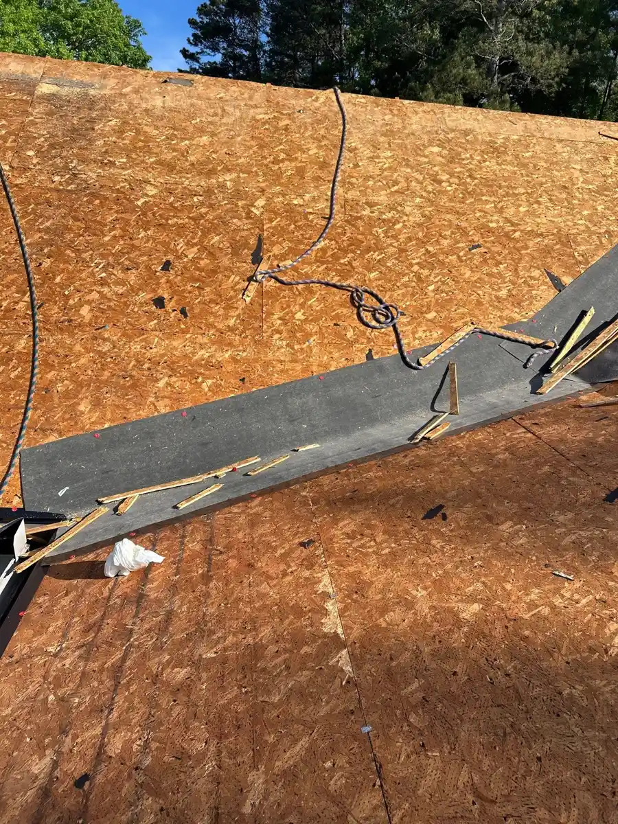 Exposed plywood roof deck with roof edge materials and cables, Southern Premier Roofing work near Talmo GA