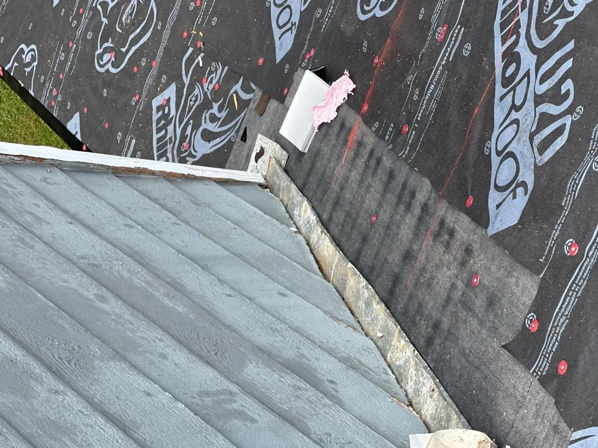 Roof valley and wall flashing detail with exposed underlayment, Southern Premier Roofing work near Tucker GA