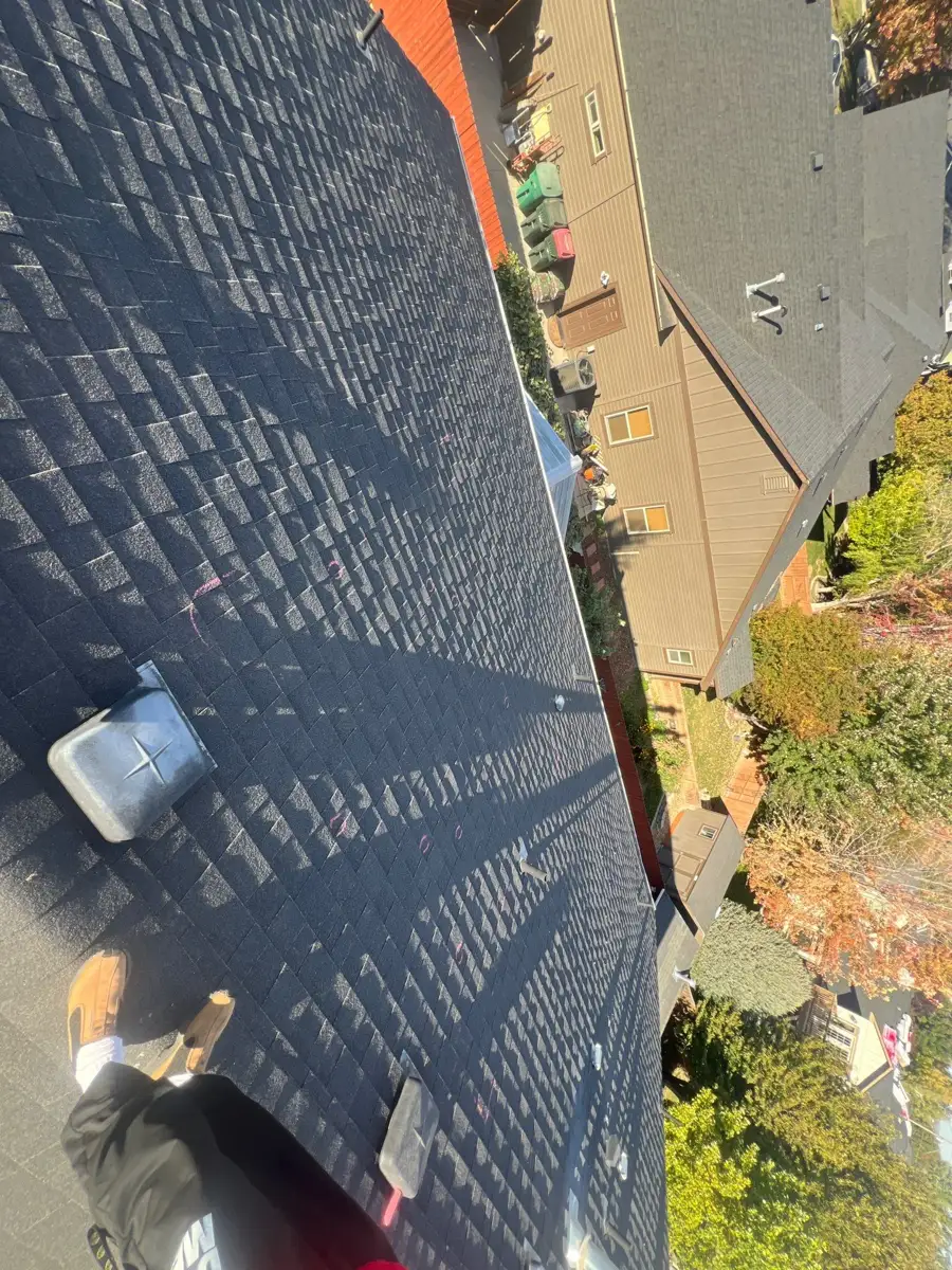 Wide view of completed shingle roof with roof fixtures, Southern Premier Roofing work near Walnut Grove GA