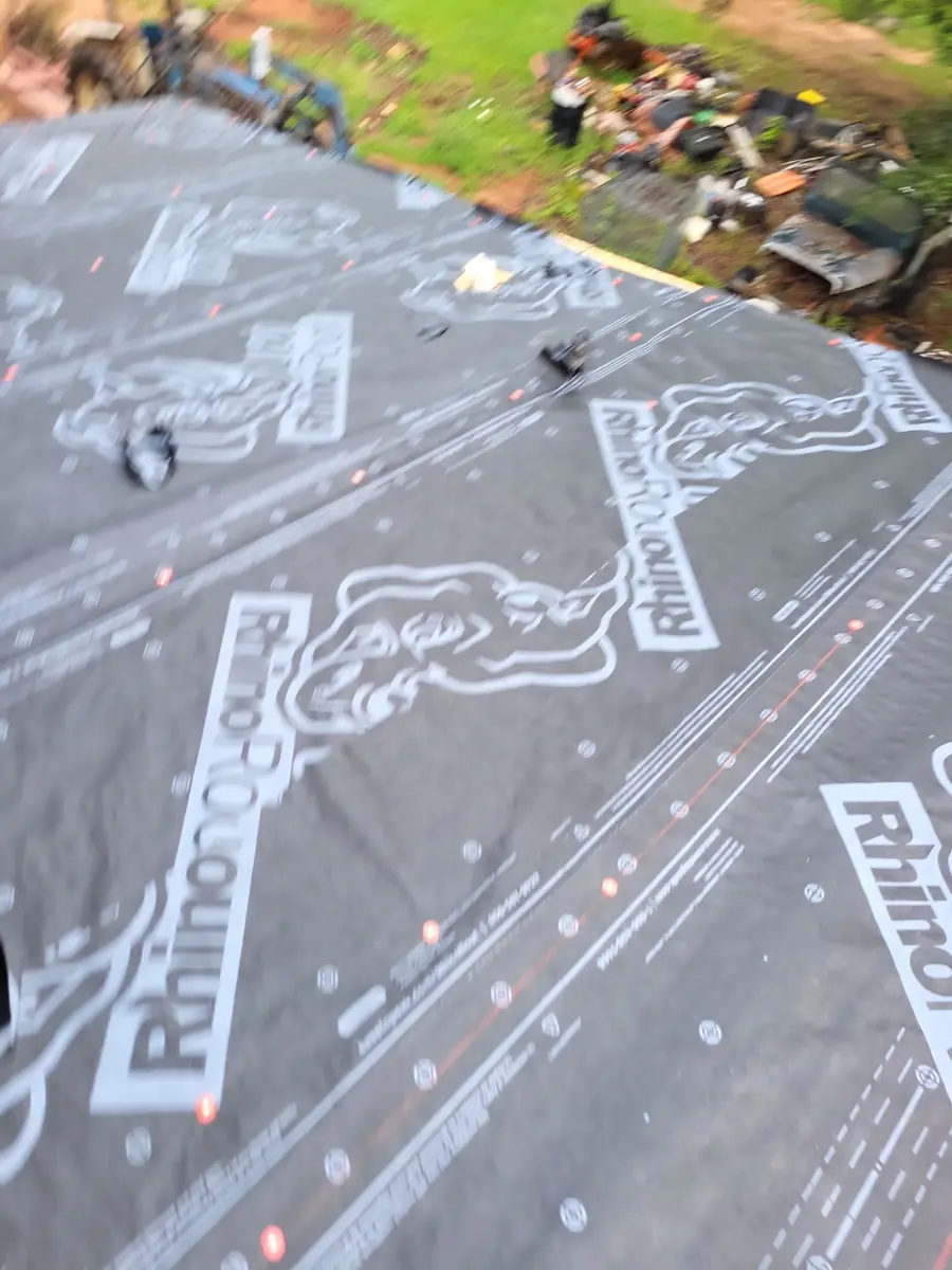 Roof covered with branded synthetic underlayment sheets, Southern Premier Roofing work near Walnut Grove GA