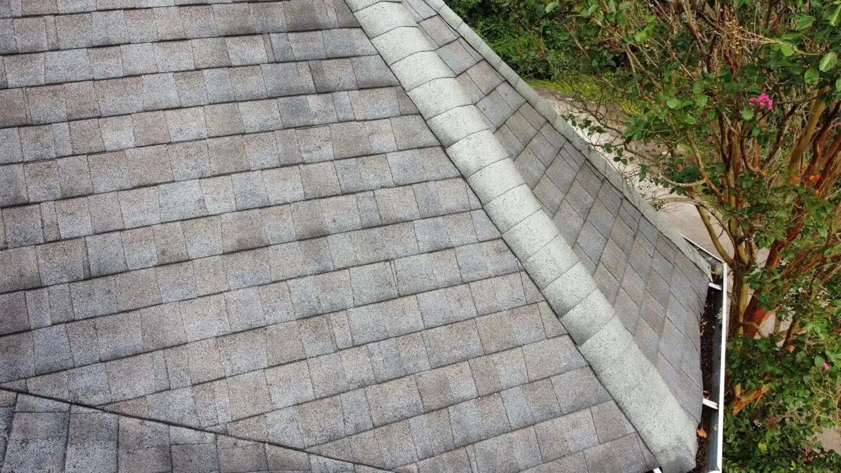 Roof edge with light ridge cap and weathered shingles, Southern Premier Roofing work near Winder GA