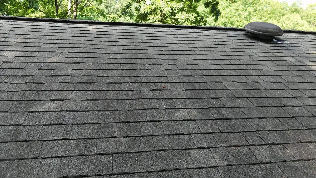 Completed dark shingle roof with low-profile roof vent, Southern Premier Roofing work near Arcade GA