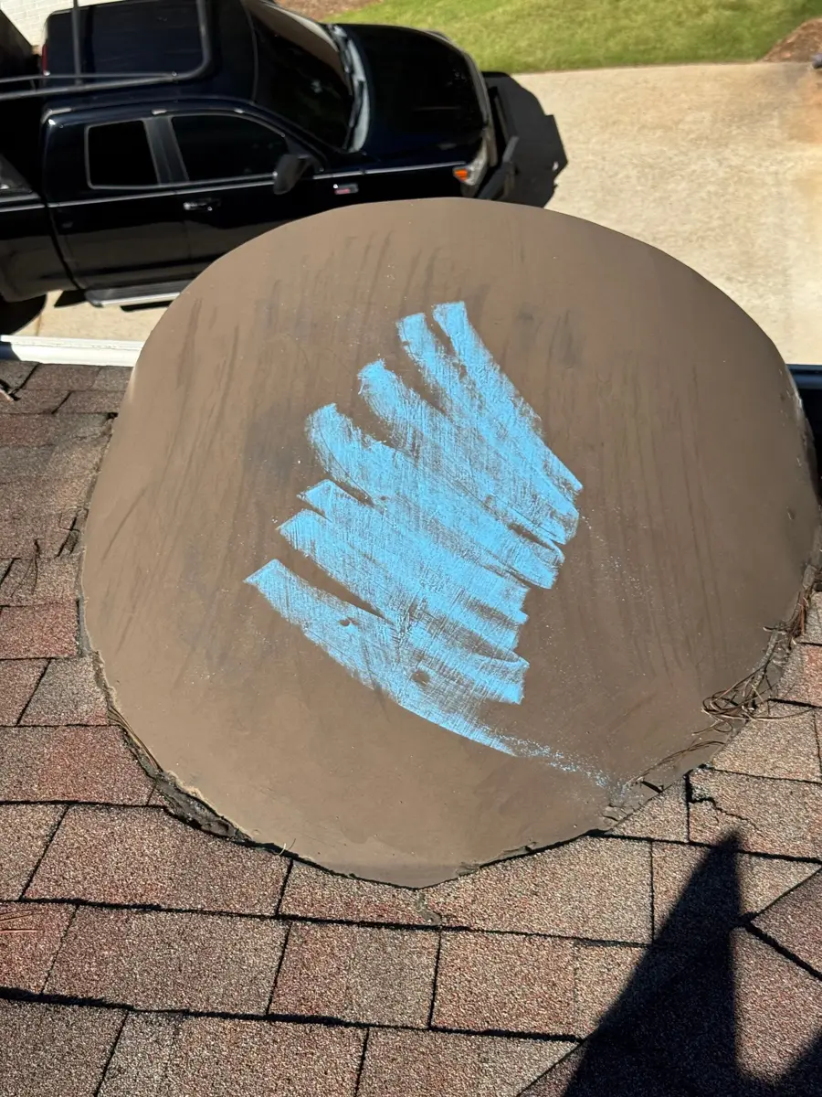 Round roof feature marked with blue paint over surrounding shingles, Southern Premier Roofing work near Athens GA