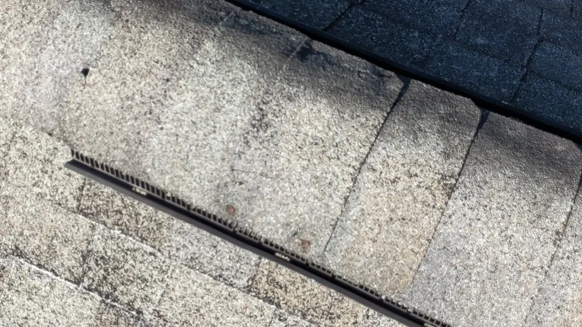 Close-up of weathered shingles with exposed linear roof feature, Southern Premier Roofing work near Auburn GA