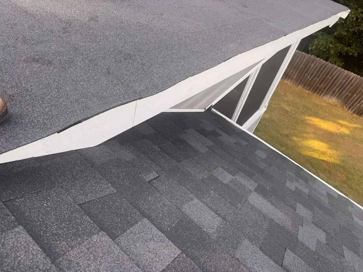 Completed shingle roof meeting a light-colored upper roof section, Southern Premier Roofing work near Bethlehem GA