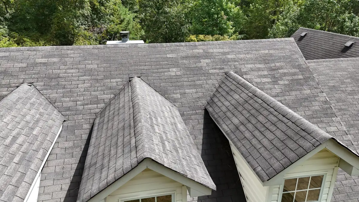 Wide roof view shows multiple intersecting shingle-covered roof sections, Southern Premier Roofing work near Bishop GA