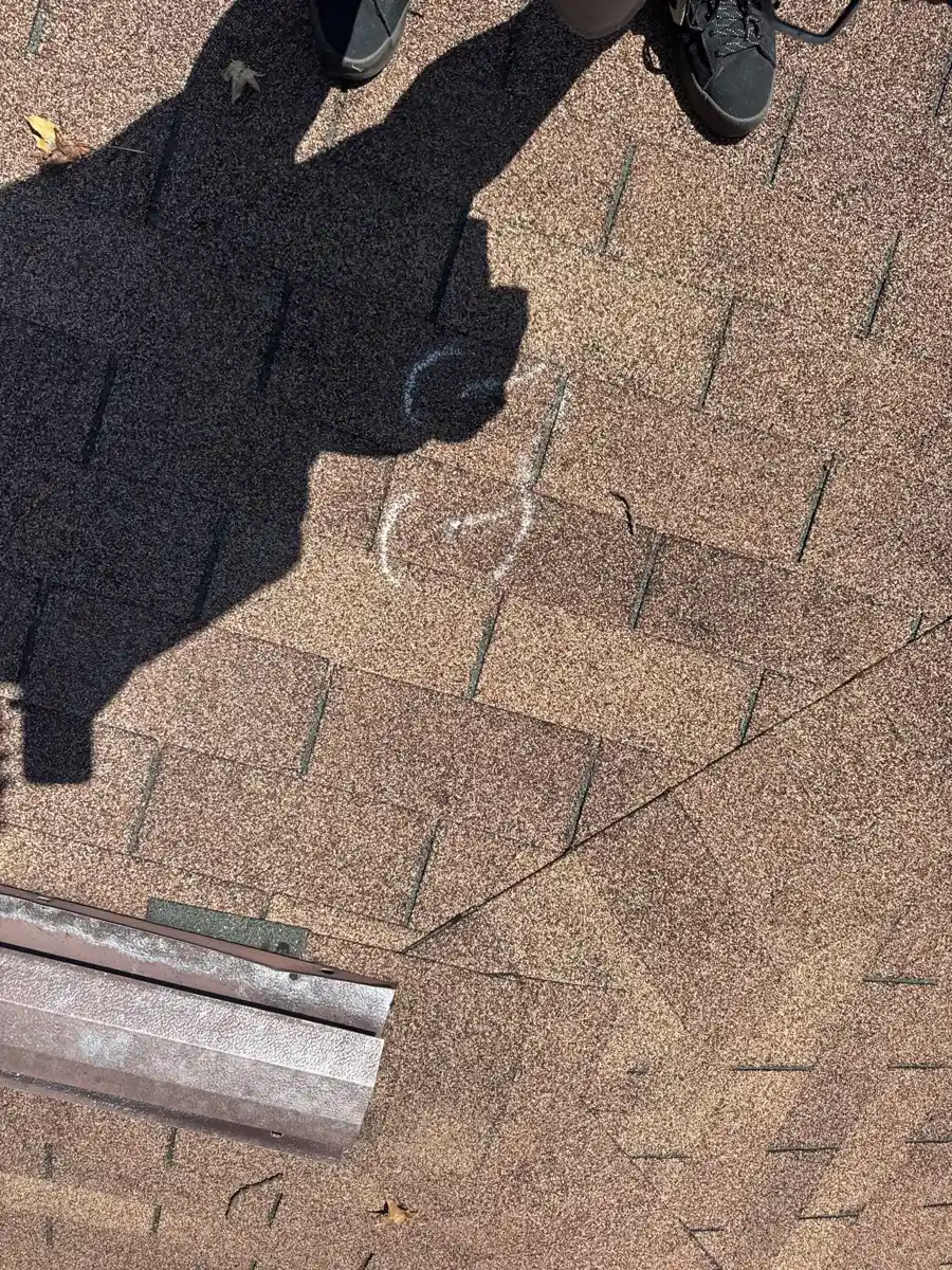 Close view of worn shingles with marked surface damage, Southern Premier Roofing work near Bostwick GA