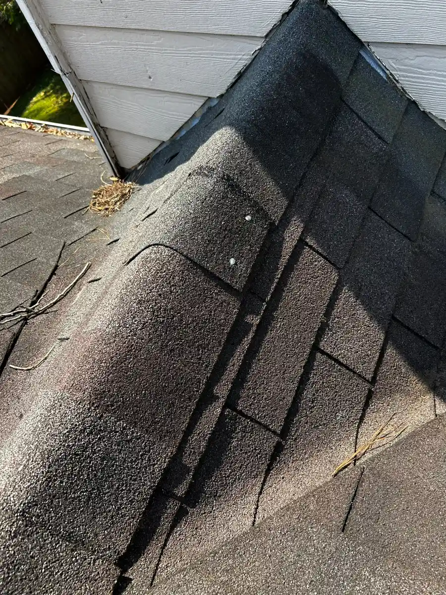Roof intersection shows dark valley flashing and surrounding shingles, Southern Premier Roofing work near Bostwick GA
