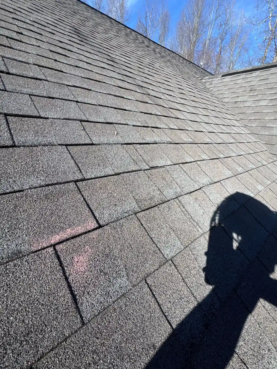 Gray shingles show visible wear and uneven discoloration, Southern Premier Roofing work near Buford GA